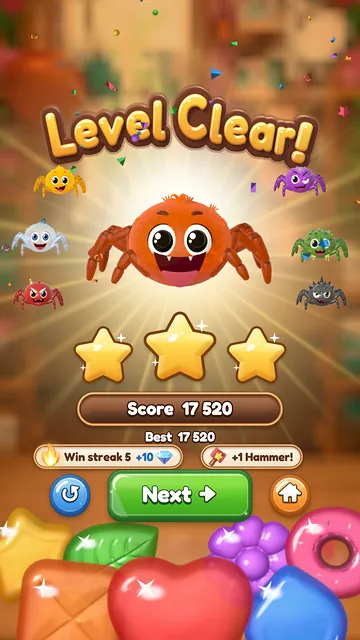 Level Clear banner with three stars and a happy spider