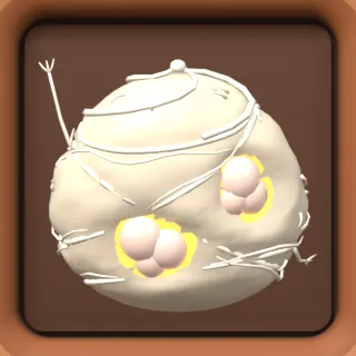 A silk egg sac with eggs peeking out